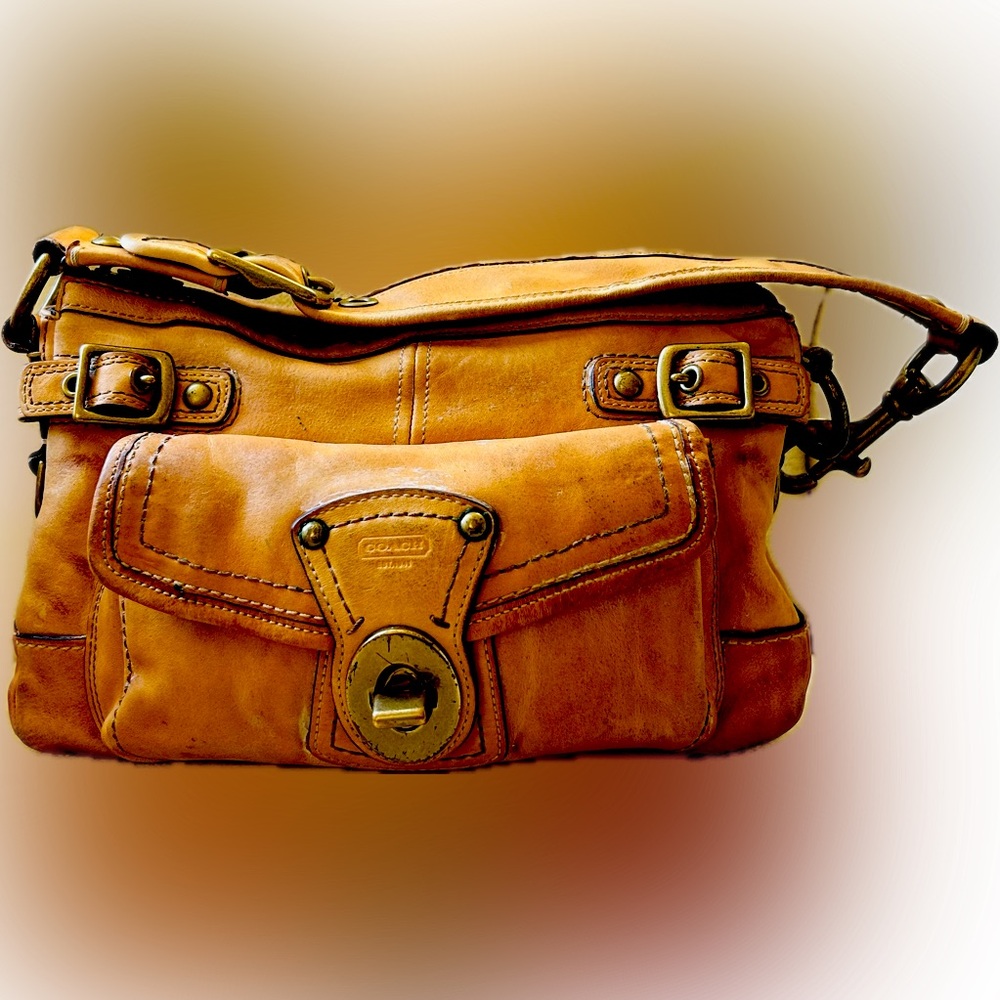 Vintage Coach handbag with strap front pocket and distressed leather